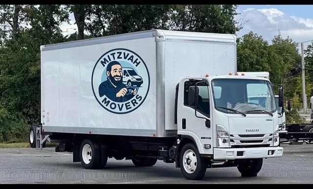 White Mitzvah Movers box truck with the company logo, used for local moves in Yonkers and Westchester