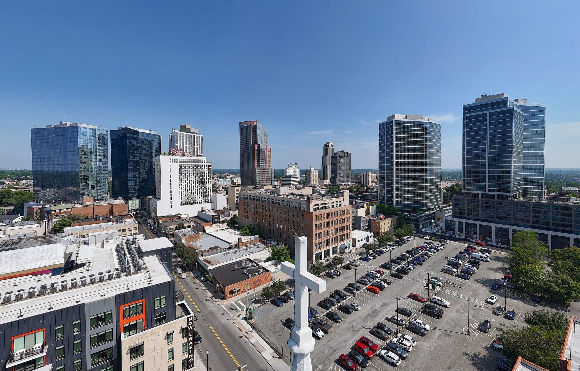 Downtown New Rochelle skyline of glass and brick apartment towers seen from above