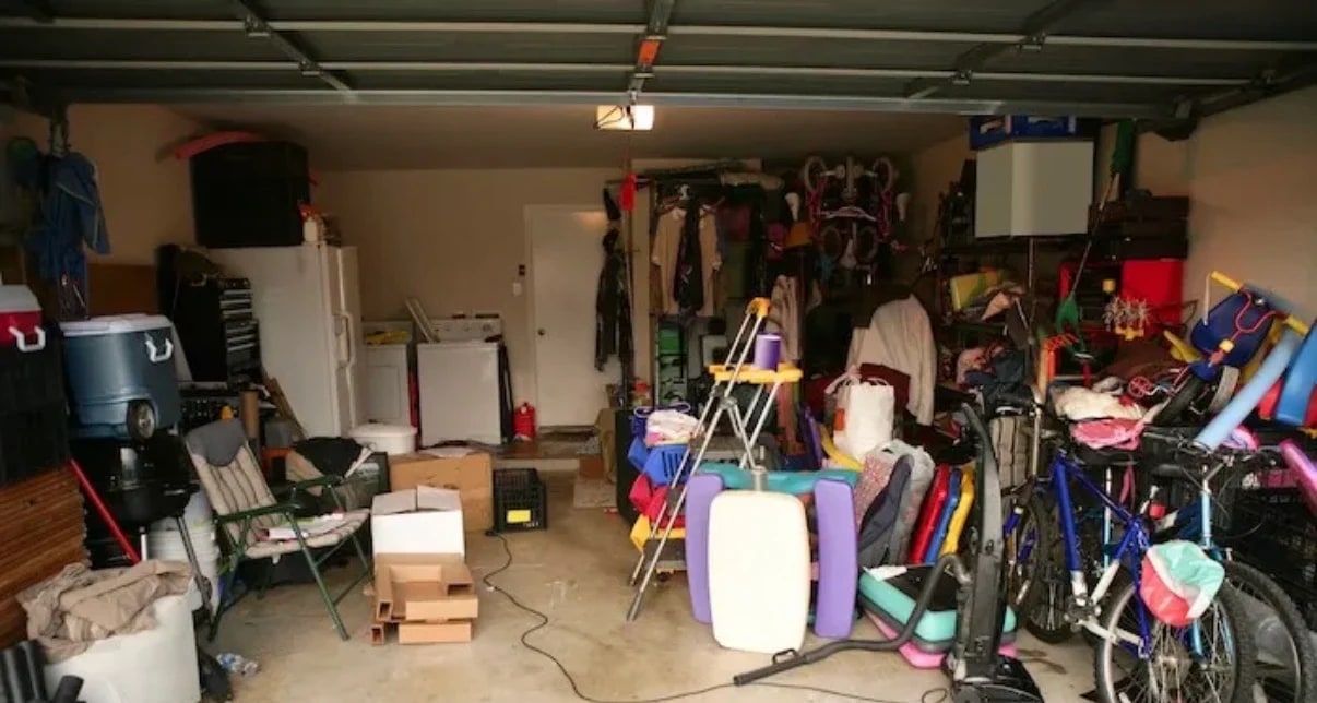 Two-car garage packed with bikes, coolers and boxes before a garage cleanout