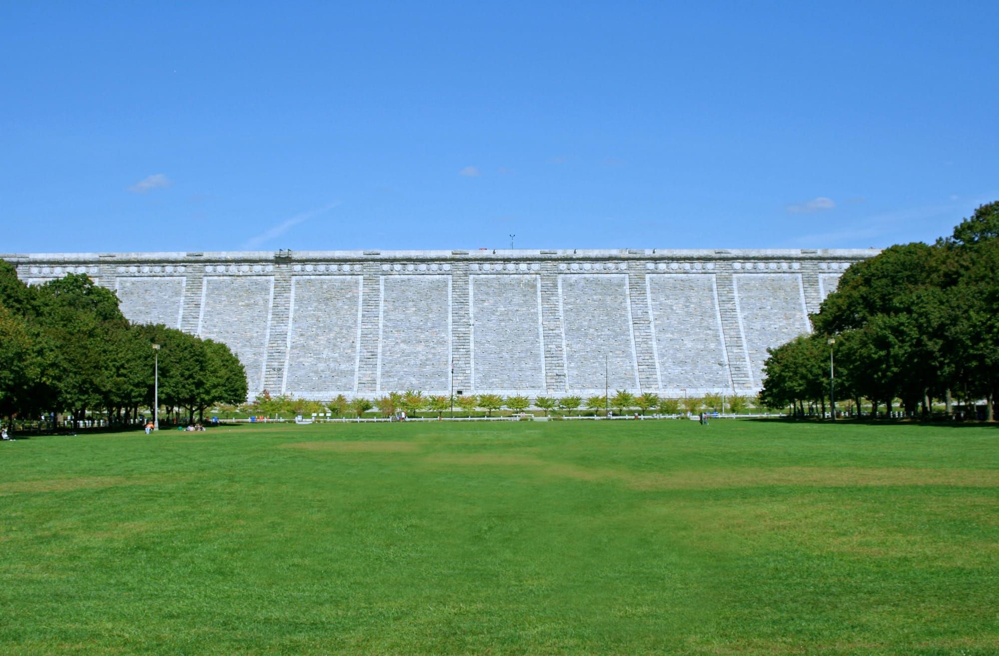 Kensico Dam rising above the green lawn of its plaza in Valhalla, Westchester County